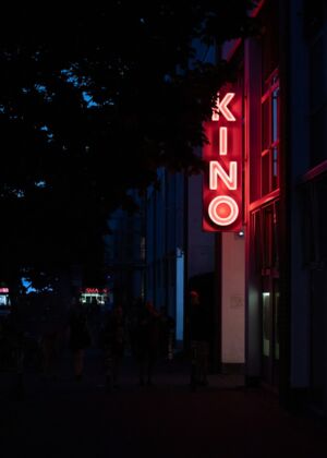 a lit up sign on a building