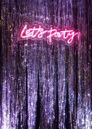 a neon sign that says let's party on it