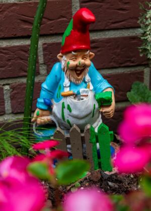 Garden gnome covered in green and blue paint