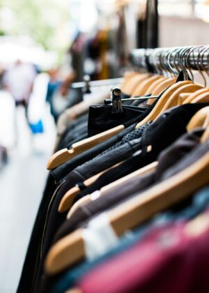 selective focus photography of hanged clothes